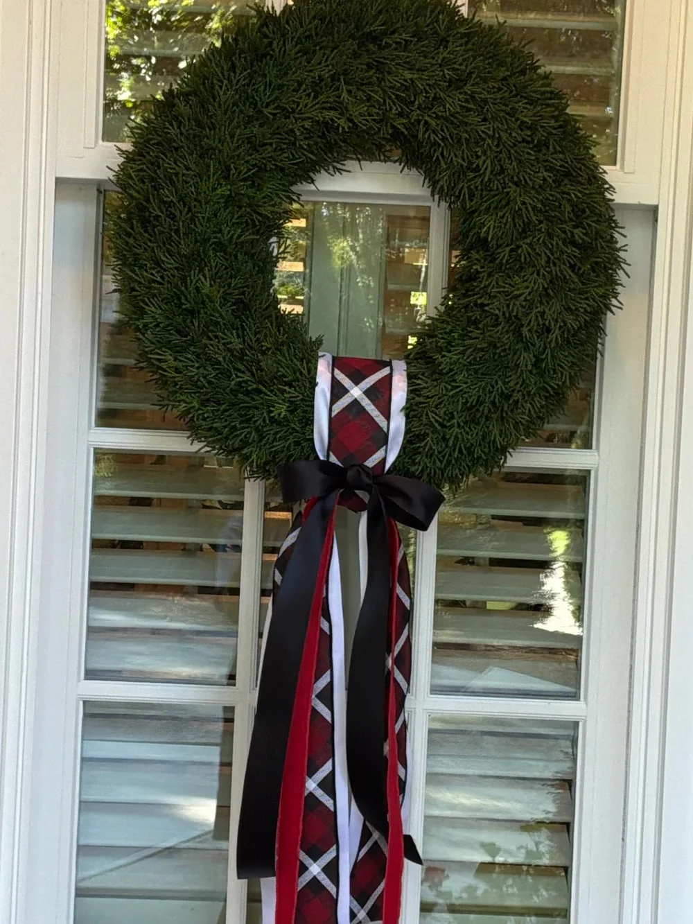 Festive Green Holiday Wreath with Red & Black Ribbon Bow